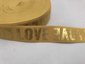 Blød elastik - velegnet til undertøj, 4 cm - med guld LOVE tekst, okker